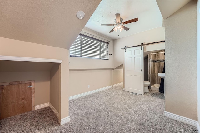 4037 S Odessa Cir, Aurora, CO 80013 - bonus room featuring baseboards, ceiling fan, carpet flooring, and a barn door