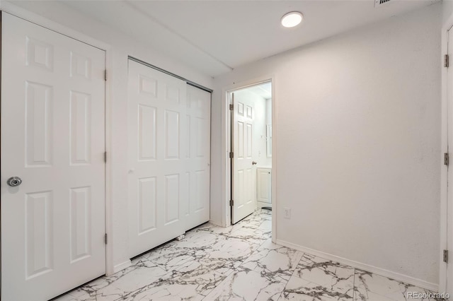 4037 S Odessa Cir, Aurora, CO 80013 - unfurnished bedroom featuring baseboards, ensuite bathroom, recessed lighting, and marble finish floor