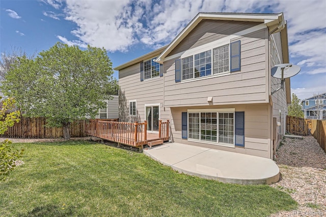4037 S Odessa Cir, Aurora, CO 80013 - rear view of house with a lawn, a fenced backyard, a deck, and a patio