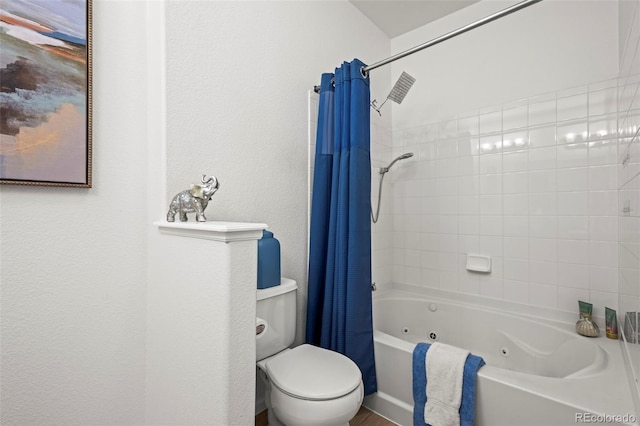 bathroom with toilet, a combined bath / shower with jetted tub, and a textured wall