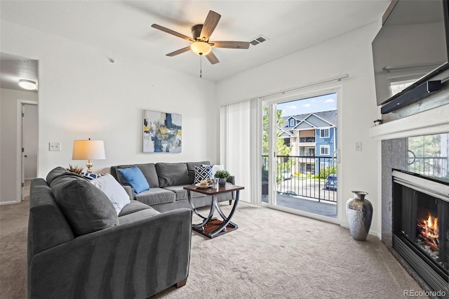 4451 S Ammons St Unit 4-203, Littleton, CO 80123 - living area featuring carpet flooring, a fireplace, and plenty of natural light
