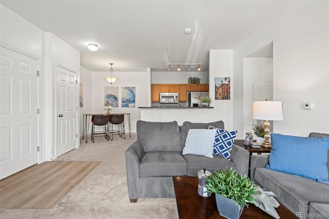 4451 S Ammons St Unit 4-203, Littleton, CO 80123 - living area with light carpet