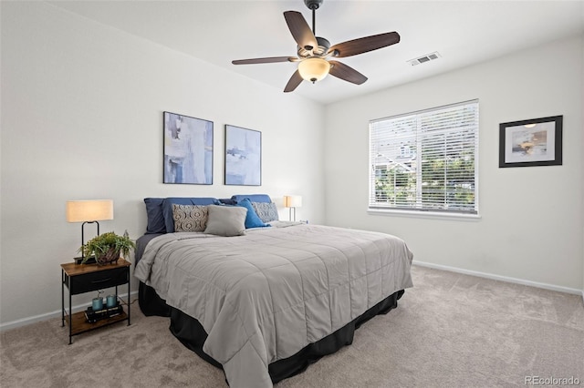 4451 S Ammons St Unit 4-203, Littleton, CO 80123 - bedroom with light colored carpet, baseboards, and a ceiling fan