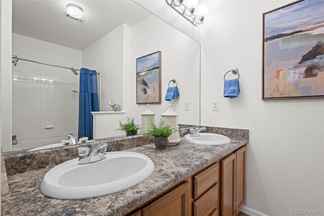 4451 S Ammons St Unit 4-203, Littleton, CO 80123 - full bathroom with double vanity and shower / tub combo