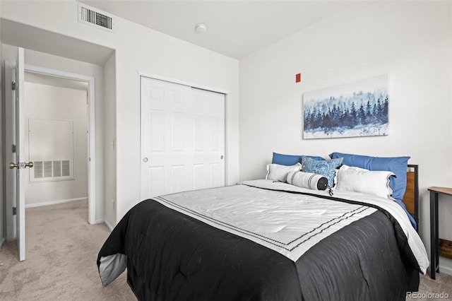 4451 S Ammons St Unit 4-203, Littleton, CO 80123 - bedroom with light carpet, baseboards, and a closet
