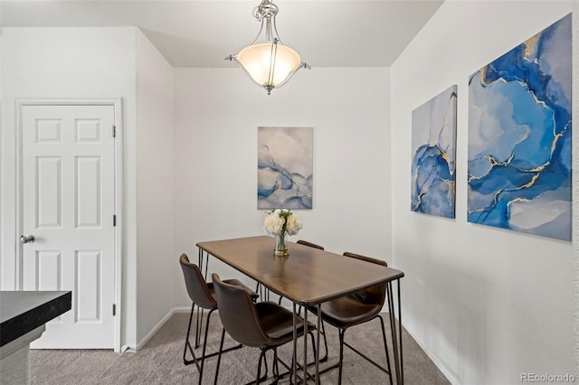 4451 S Ammons St Unit 4-203, Littleton, CO 80123 - dining room with carpet flooring and baseboards