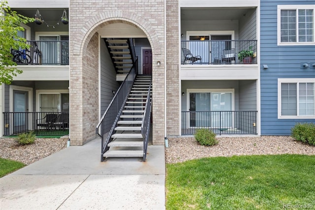 4451 S Ammons St Unit 4-203, Littleton, CO 80123 - doorway to property with brick siding