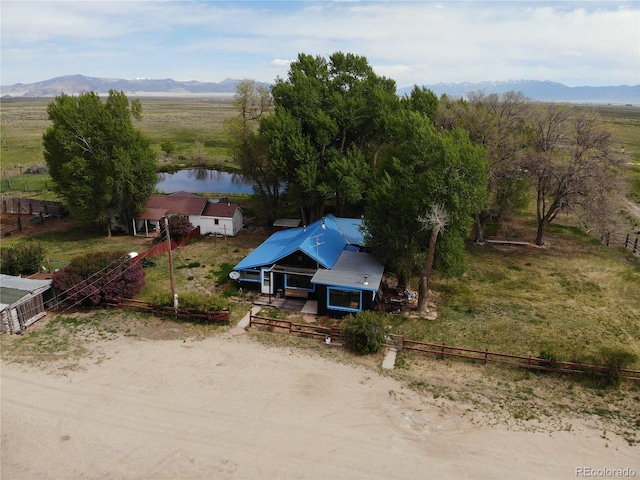 bird's eye view featuring a water and mountain view and a rural view