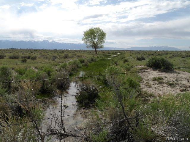 property view of mountains featuring a rural view