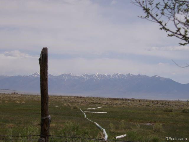 property view of mountains featuring a rural view