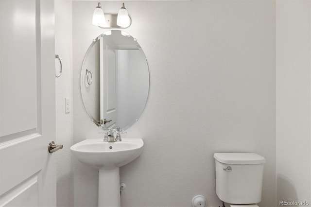 bathroom featuring toilet