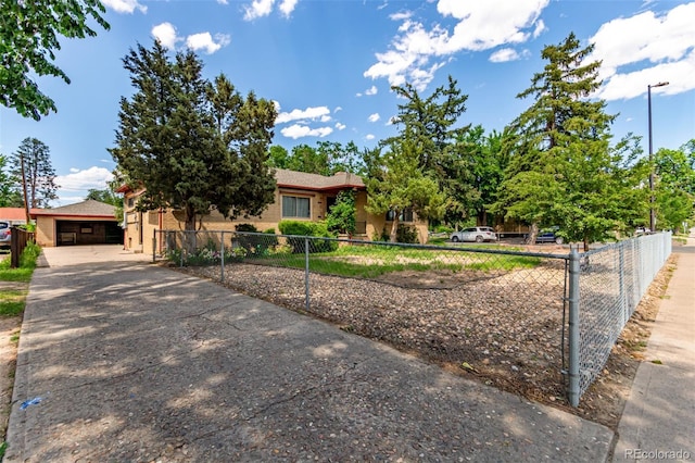 10841 Montview Blvd, Aurora, CO 80010 - view of property hidden behind natural elements with a fenced front yard and a garage