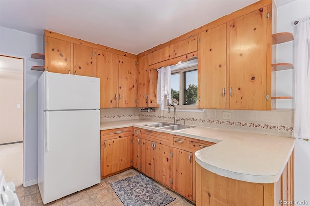 10841 Montview Blvd, Aurora, CO 80010 - kitchen featuring freestanding refrigerator, tasteful backsplash, light countertops, and open shelves