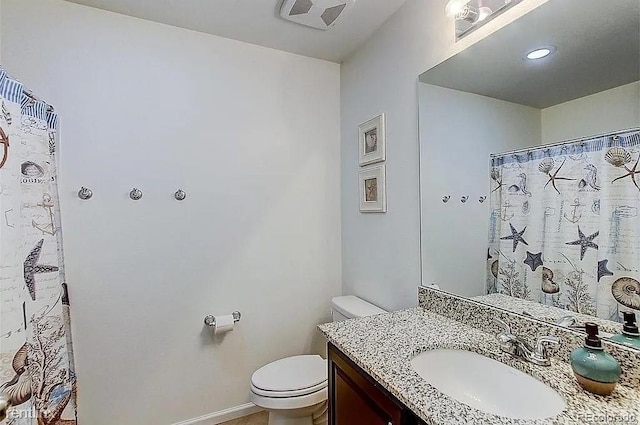 bathroom with vanity and toilet