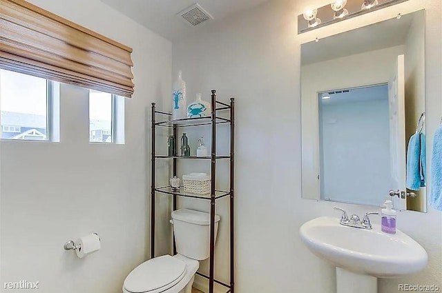 bathroom featuring sink and toilet