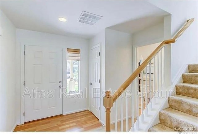 foyer entrance featuring hardwood / wood-style floors