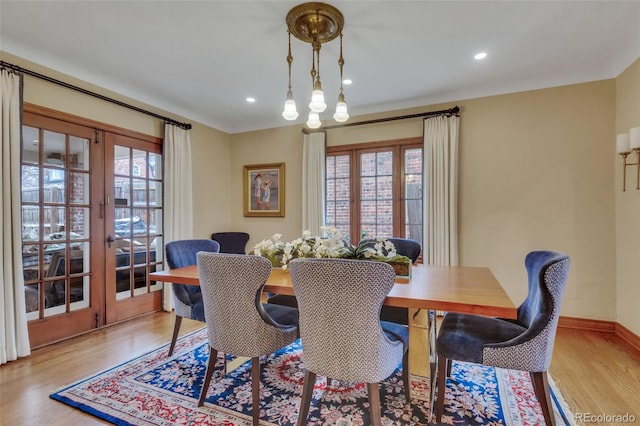 dining area with recessed lighting, wood finished floors, and a healthy amount of sunlight