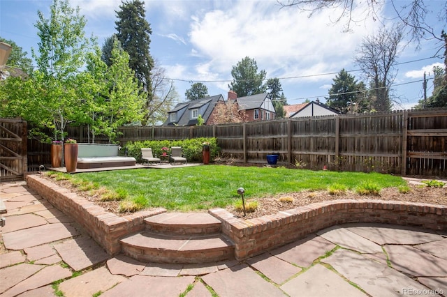 view of yard featuring a fenced backyard and a patio area