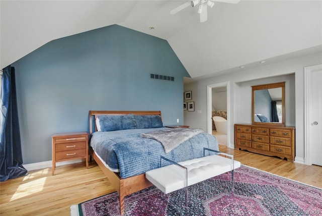 bedroom featuring high vaulted ceiling, a ceiling fan, wood finished floors, and visible vents