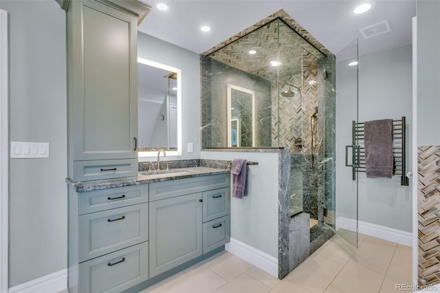 full bath with vanity, a stall shower, tile patterned floors, and visible vents