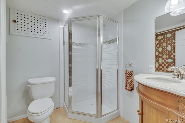 full bath featuring vanity, toilet, tile patterned flooring, and a stall shower