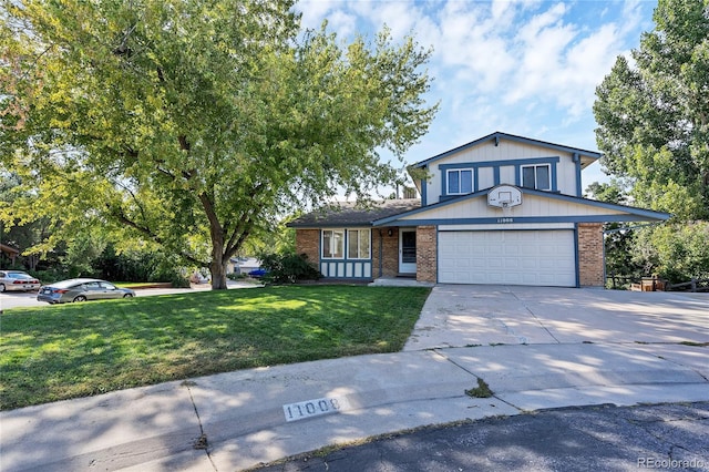 view of front of home with a garage and a front lawn