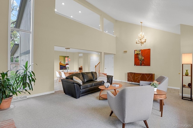 7882 S Valentia Way, Centennial, CO 80112 - living area featuring high vaulted ceiling, stairs, carpet floors, a chandelier, and baseboards