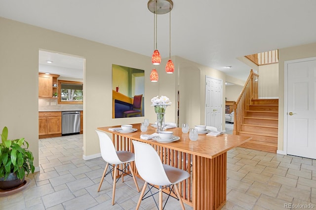 7882 S Valentia Way, Centennial, CO 80112 - dining space with stairs, baseboards, and light stone finish floors