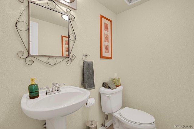 7882 S Valentia Way, Centennial, CO 80112 - bathroom featuring a sink, toilet, and baseboards