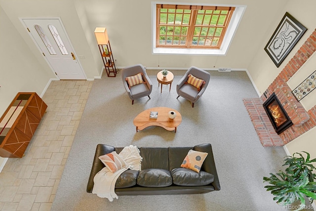 7882 S Valentia Way, Centennial, CO 80112 - living room featuring a brick fireplace and baseboards
