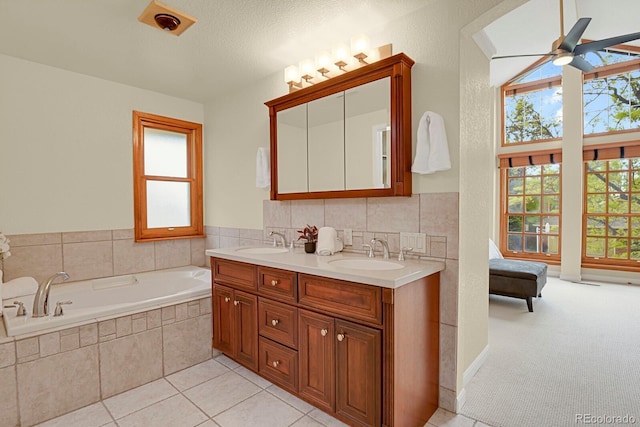 7882 S Valentia Way, Centennial, CO 80112 - full bath with plenty of natural light, a garden tub, ceiling fan, and double vanity
