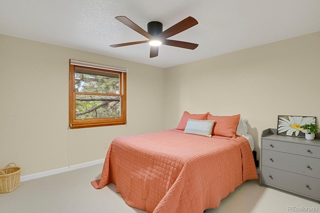 7882 S Valentia Way, Centennial, CO 80112 - bedroom with light colored carpet, baseboards, and a ceiling fan