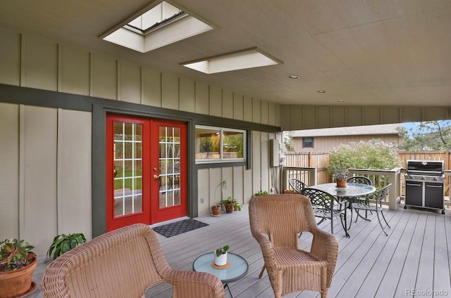 7882 S Valentia Way, Centennial, CO 80112 - wooden deck with french doors, a grill, and outdoor dining area