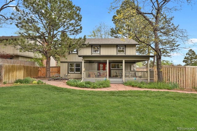 7882 S Valentia Way, Centennial, CO 80112 - view of front of home with a chimney, covered porch, and roof with shingles