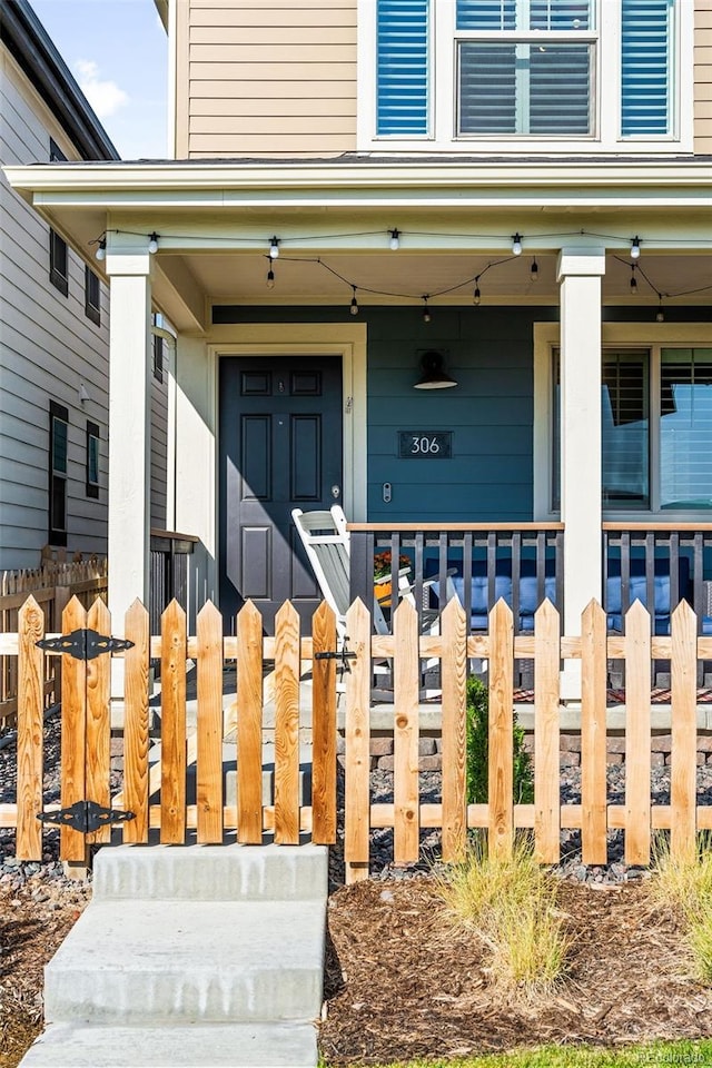 property entrance featuring covered porch