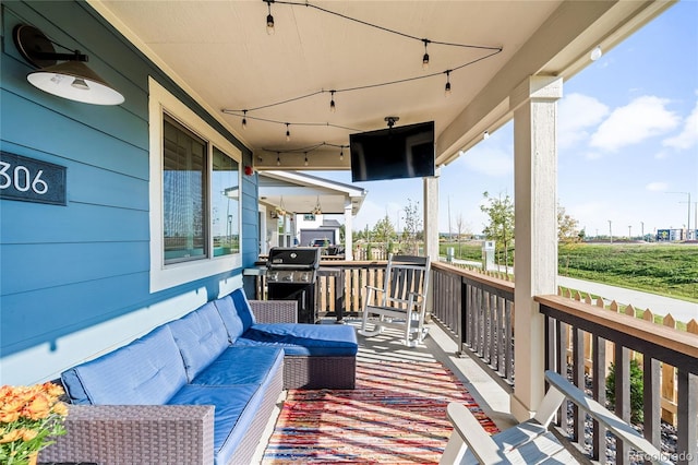 wooden deck featuring grilling area