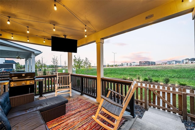 wooden deck with grilling area