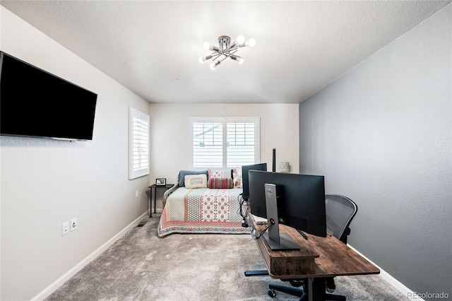 bedroom with a chandelier, a textured ceiling, and carpet floors