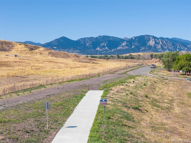 mountain view featuring a rural view