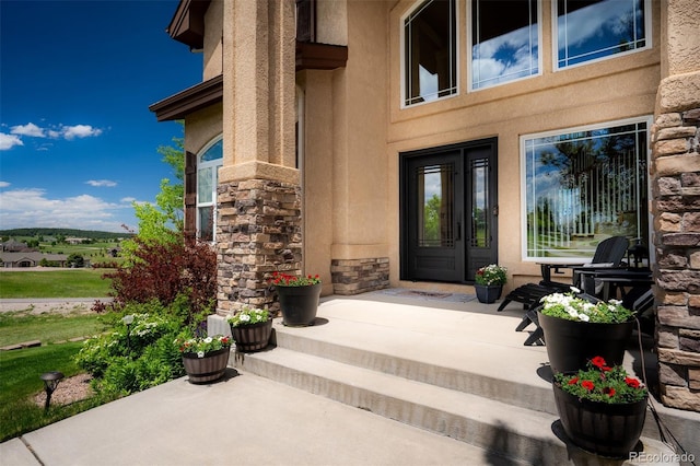 19735 Knights Xing, Monument, CO 80132 - view of exterior entry with stone siding and stucco siding