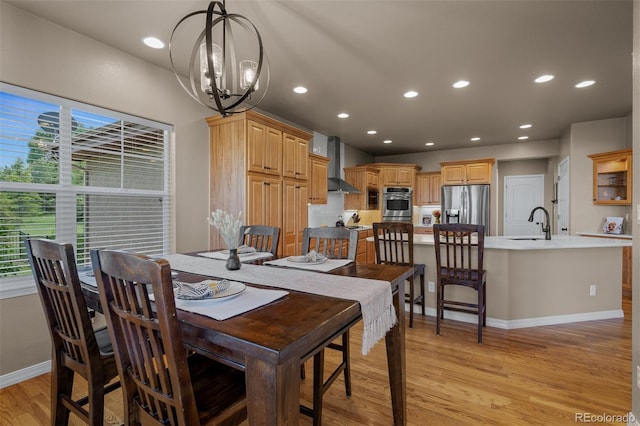 19735 Knights Xing, Monument, CO 80132 - dining area featuring light wood-type flooring, a chandelier, and recessed lighting