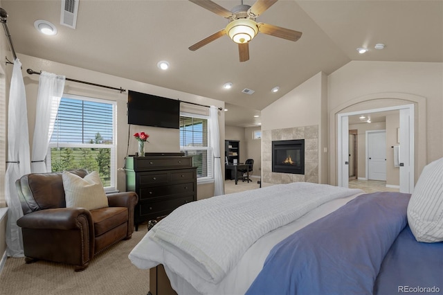 19735 Knights Xing, Monument, CO 80132 - bedroom with lofted ceiling, a tile fireplace, recessed lighting, light colored carpet, and a ceiling fan