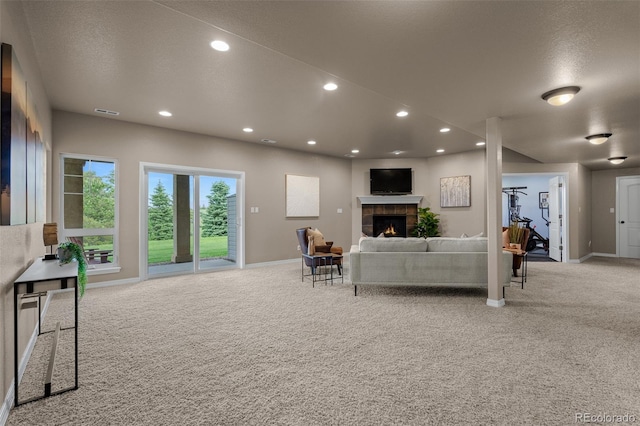 19735 Knights Xing, Monument, CO 80132 - carpeted living room with a fireplace and recessed lighting