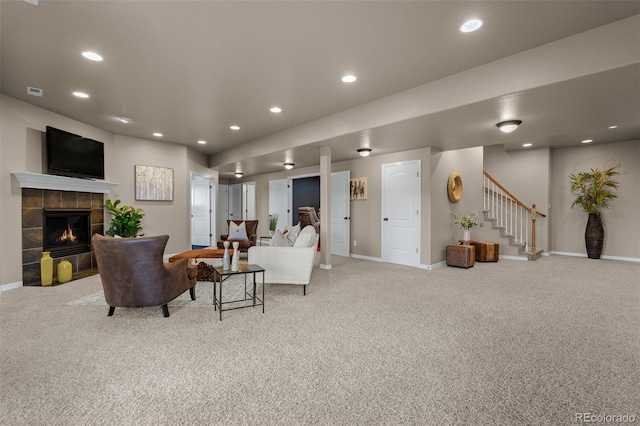 19735 Knights Xing, Monument, CO 80132 - living area featuring carpet, stairway, a tiled fireplace, and recessed lighting