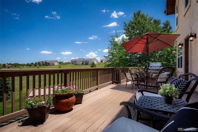 19735 Knights Xing, Monument, CO 80132 - wooden terrace featuring outdoor dining area and a residential view