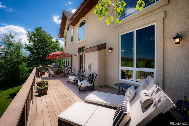 19735 Knights Xing, Monument, CO 80132 - wooden terrace featuring outdoor dining space
