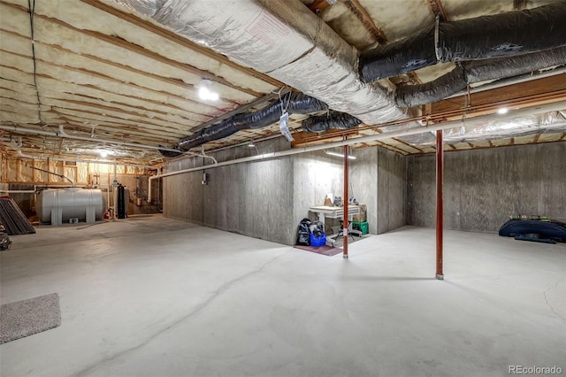 unfinished basement featuring heating fuel