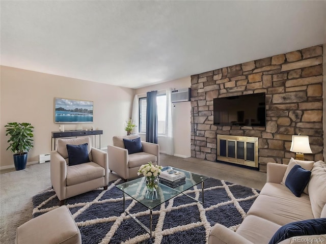 381 S Ames St Unit G101, Lakewood, CO 80226 - carpeted living area featuring a baseboard radiator, a stone fireplace, and a wall mounted air conditioner