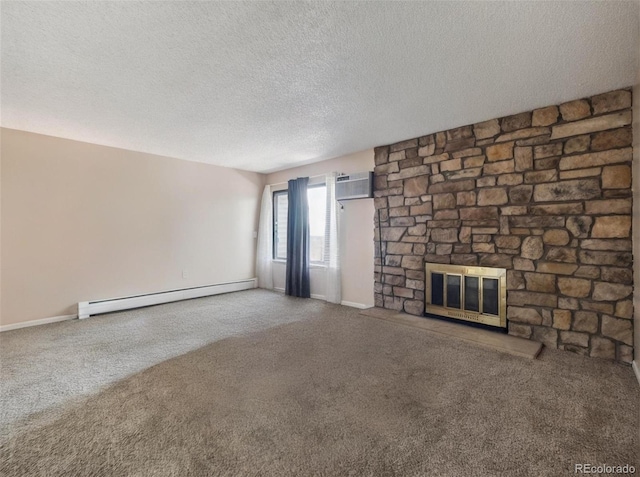 381 S Ames St Unit G101, Lakewood, CO 80226 - unfurnished living room with a baseboard heating unit, carpet flooring, a stone fireplace, a textured ceiling, and a wall mounted AC