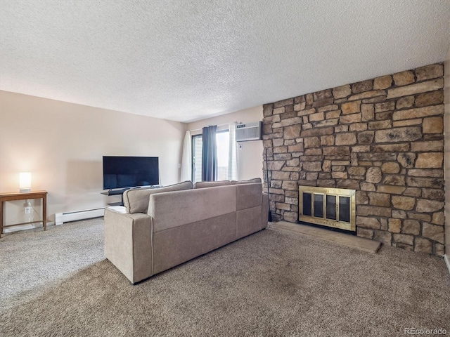 381 S Ames St Unit G101, Lakewood, CO 80226 - carpeted living room featuring a stone fireplace, a baseboard radiator, a textured ceiling, and a wall mounted air conditioner